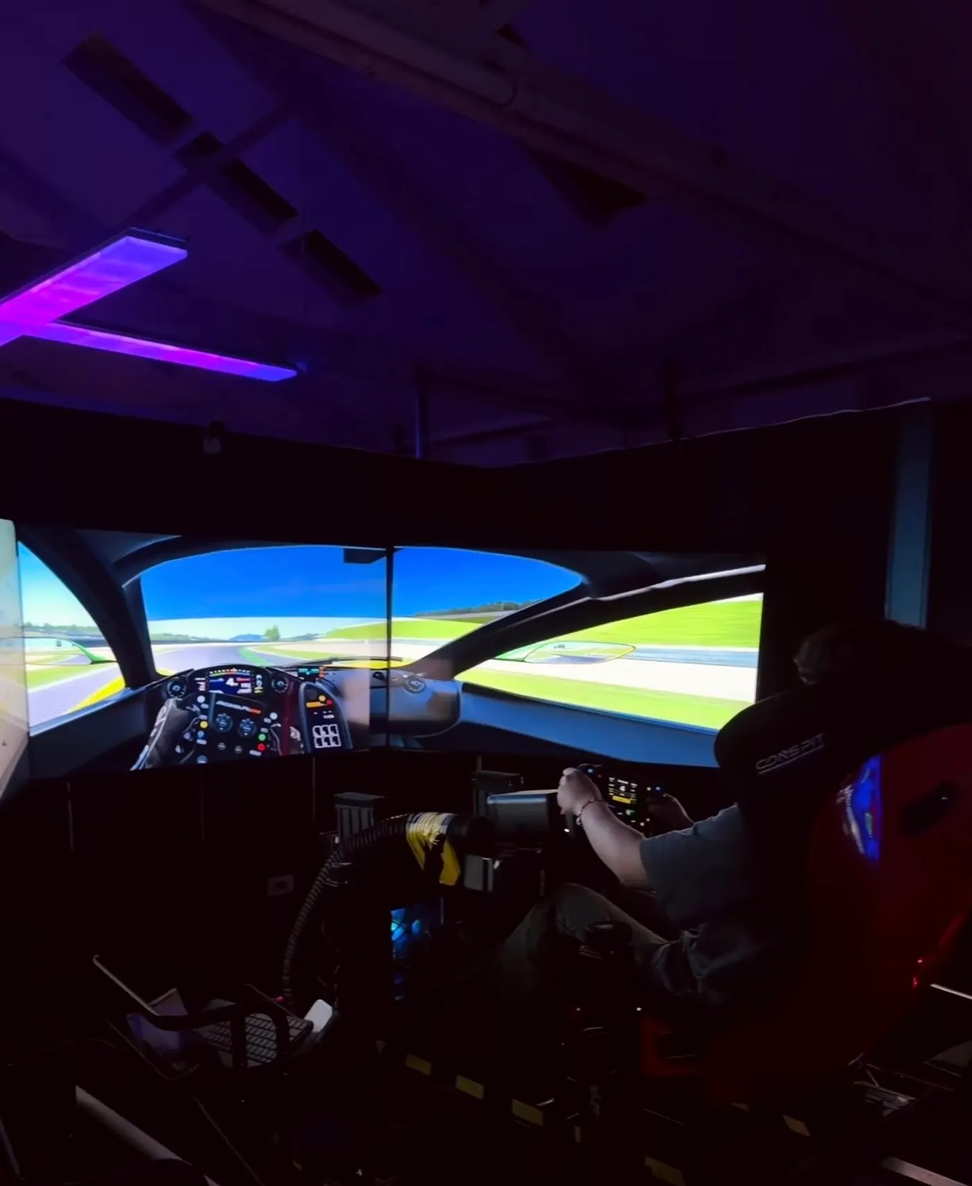 Triple-screen motion racing simulator at G3 Melbourne — Simagic direct-drive wheel, Assetto Corsa on track